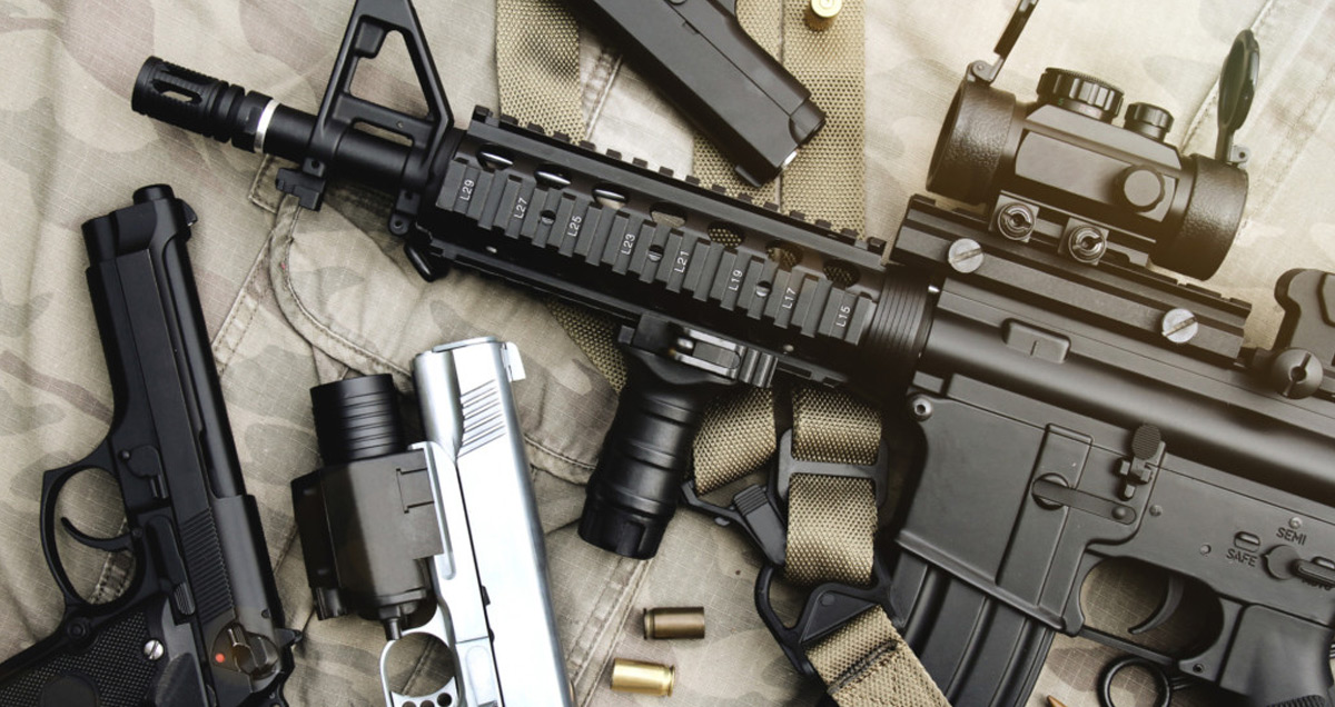 Weapons and military equipment for army, Assault rifle gun (M4A1) and pistol on camouflage background. The Most Common Types of Guns Explained